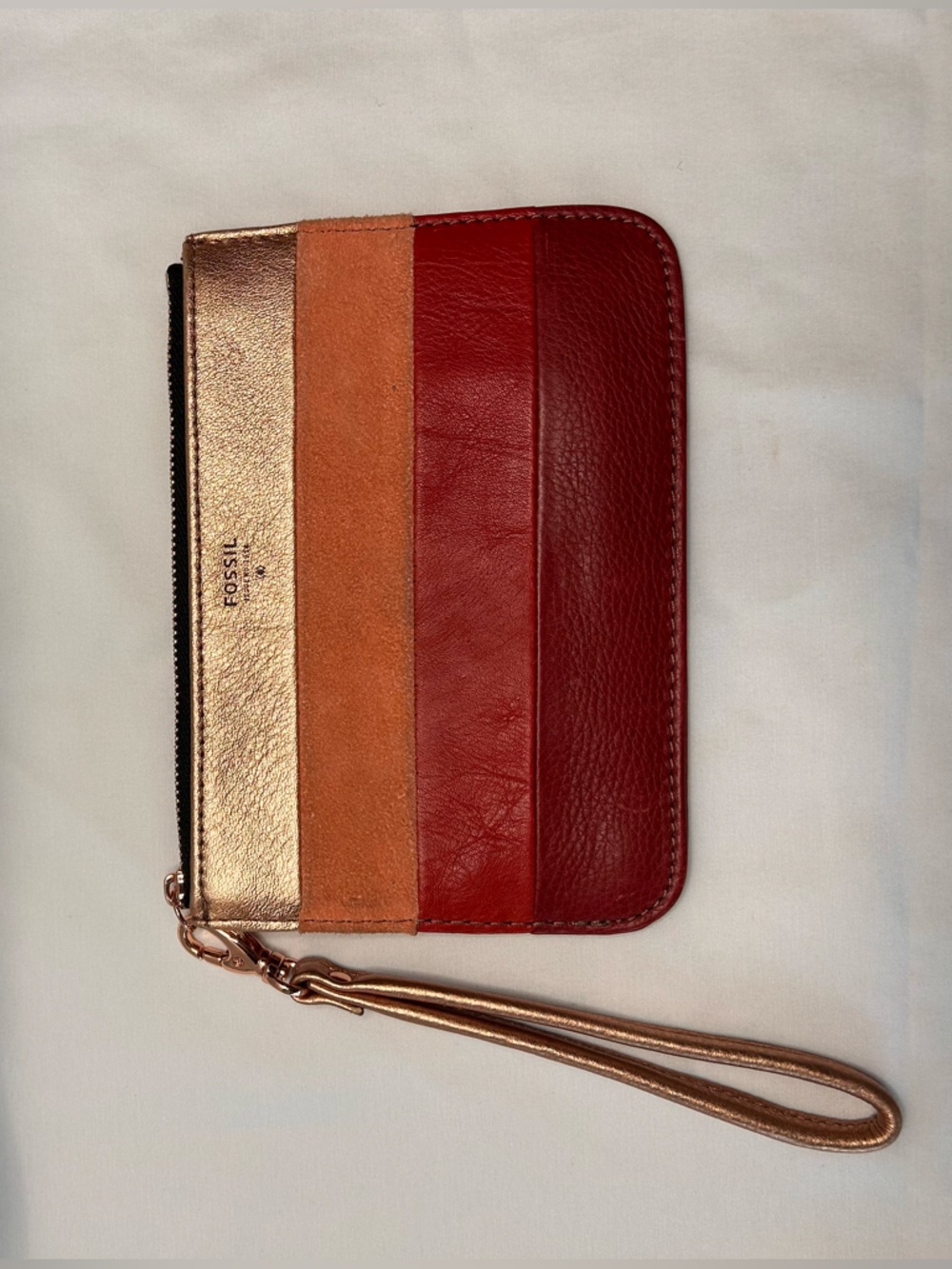 Fossil Rose Gold, Orange-Tan and Red Leather Wristlet. Gently used.
